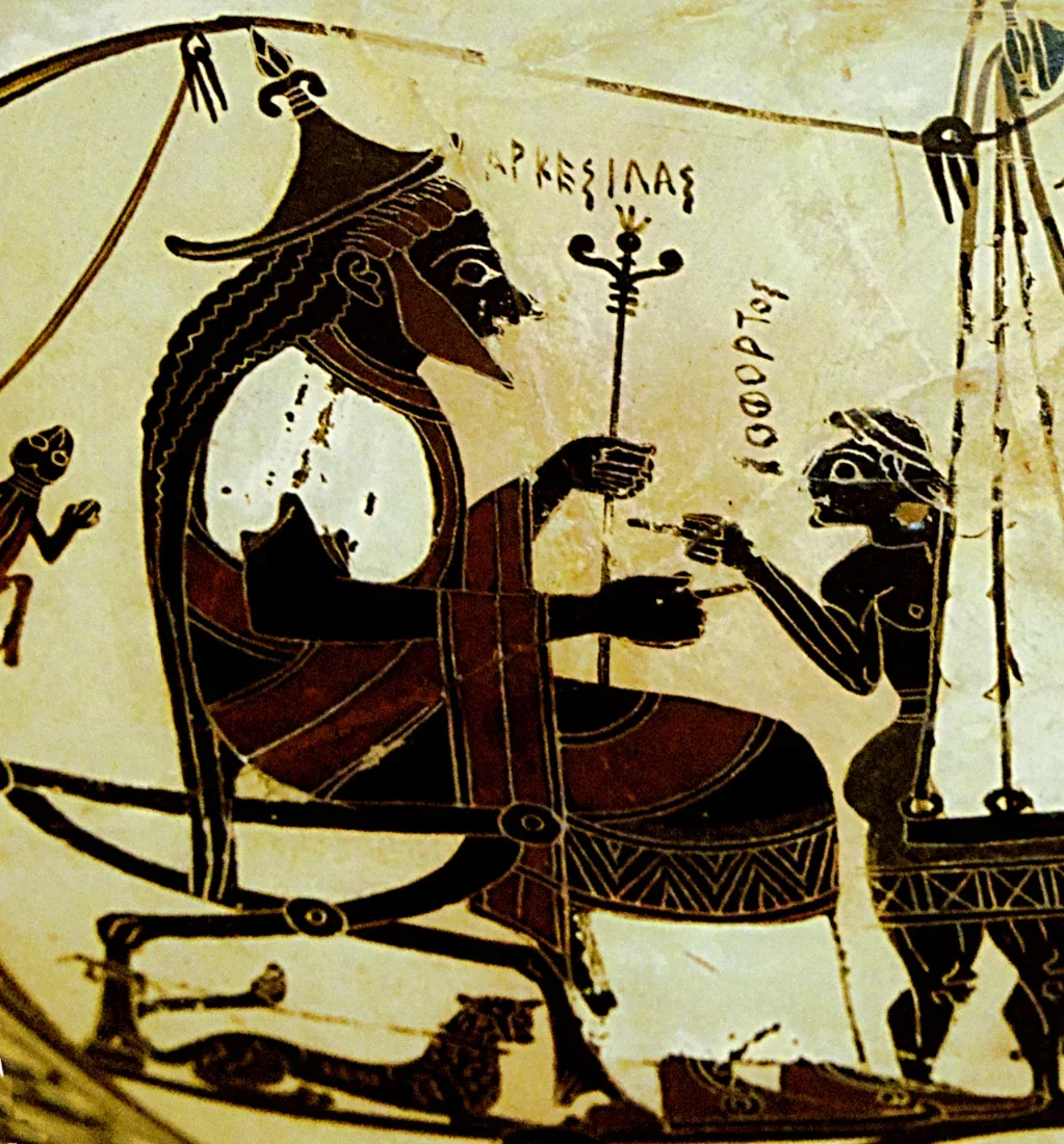 A painted cup interior: a seated king under an awning, workers weighing bales on a large balance.