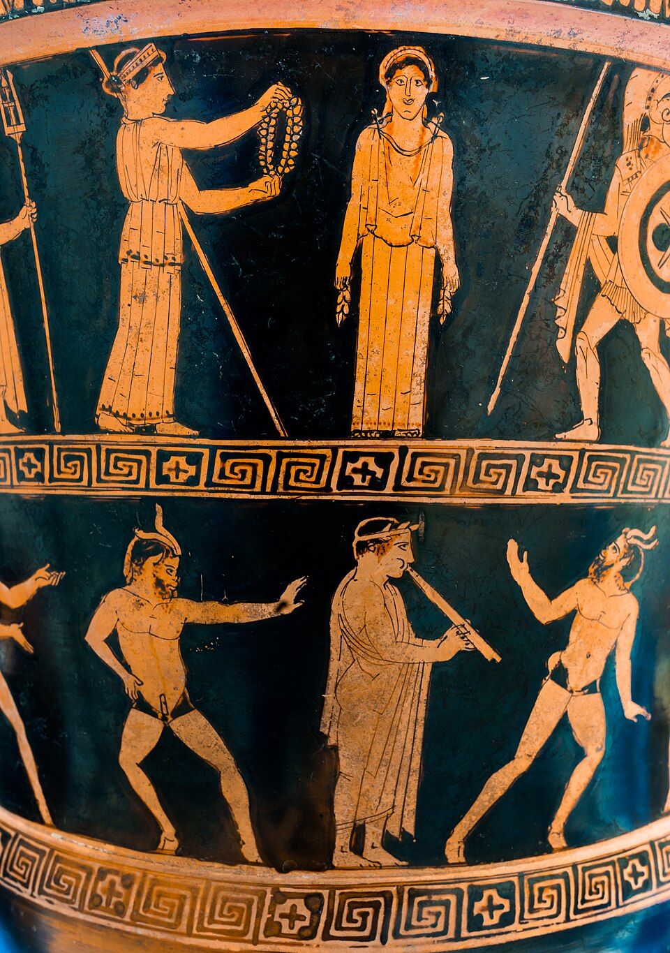 Red-figure krater with two friezes: gods above, a piper and dancers below.