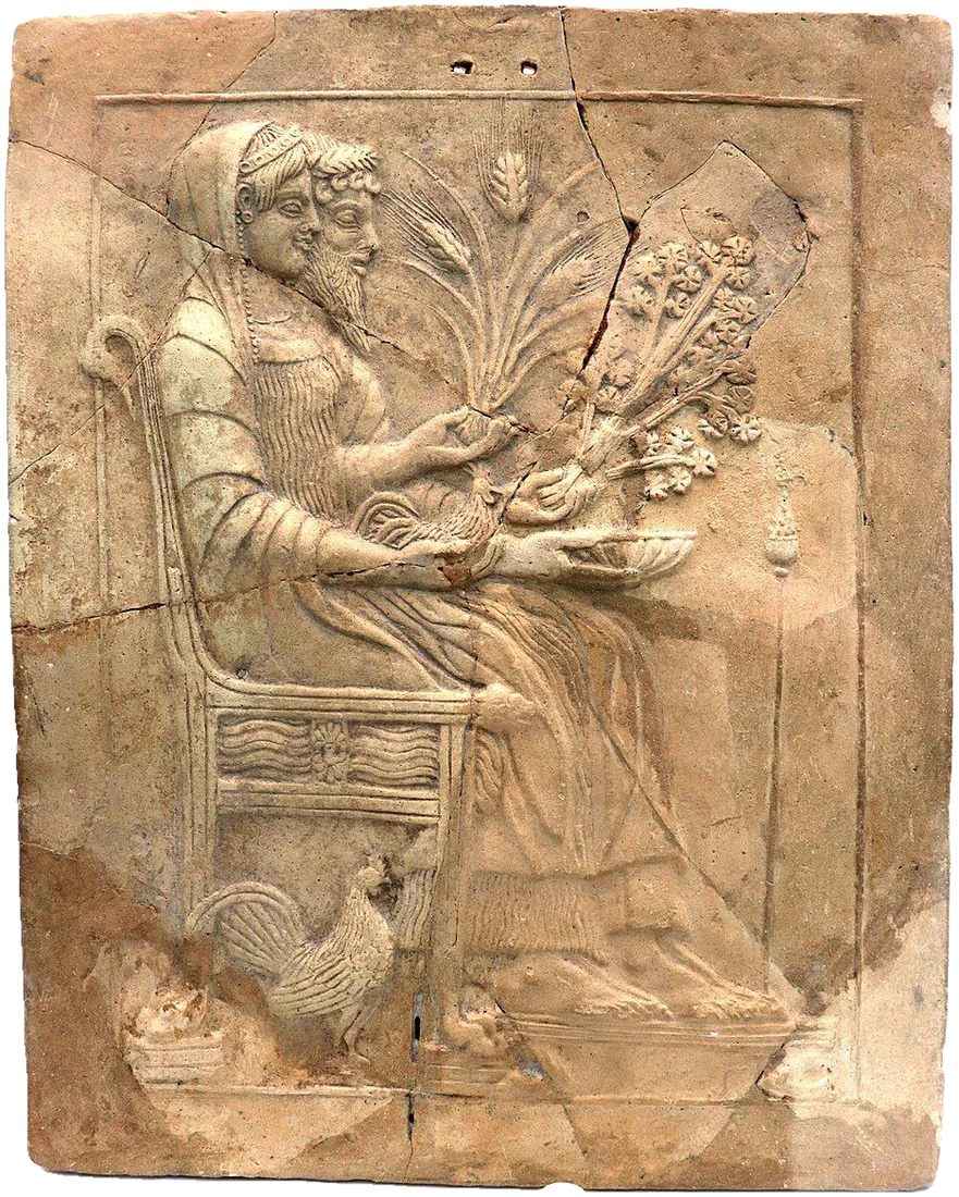 Terracotta relief plaque: a god and goddess seated side by side on a throne.