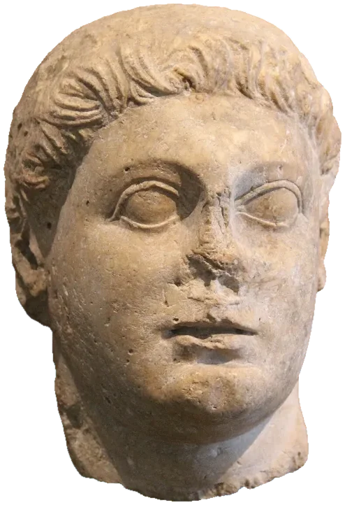 Marble portrait head of a young man with short curly hair, its nose damaged.