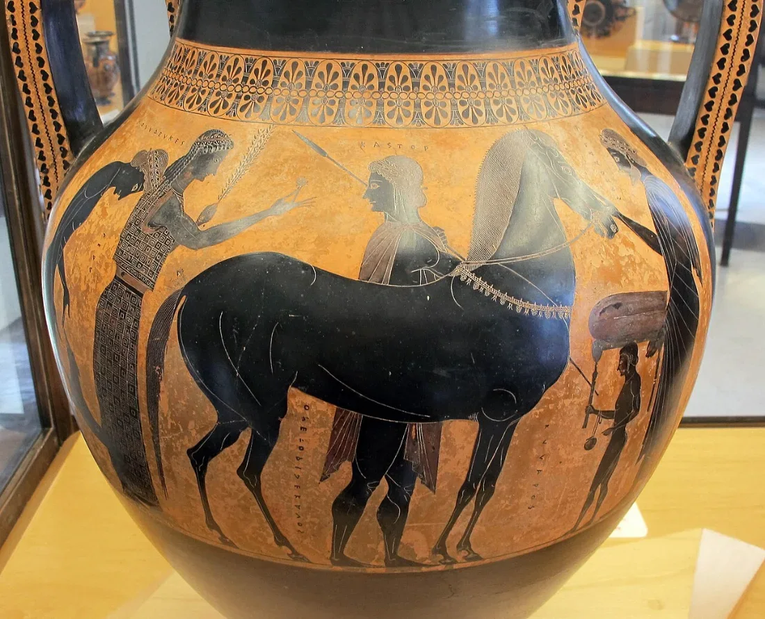 A black-figure amphora: a horse and a youth beside it, with other figures.