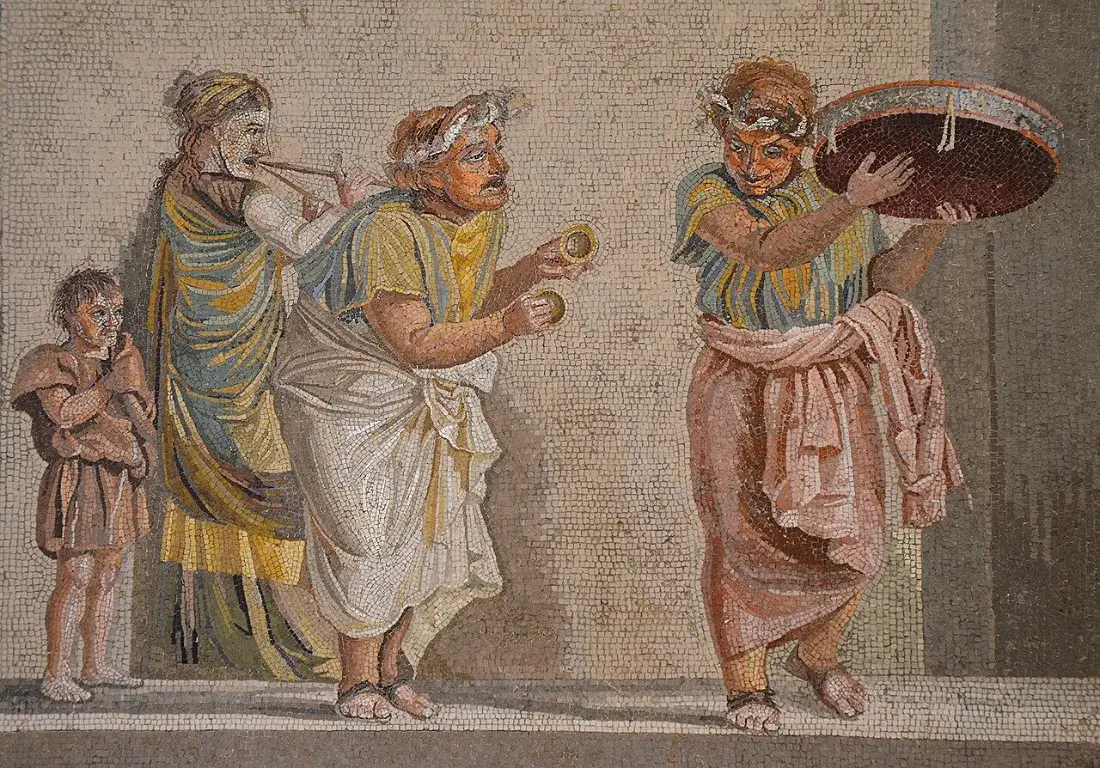 A fine mosaic of masked musicians with a tambourine, cymbals and double pipe.
