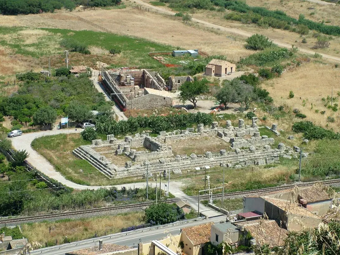 Foundations of a temple in the plain, seen from a hill.