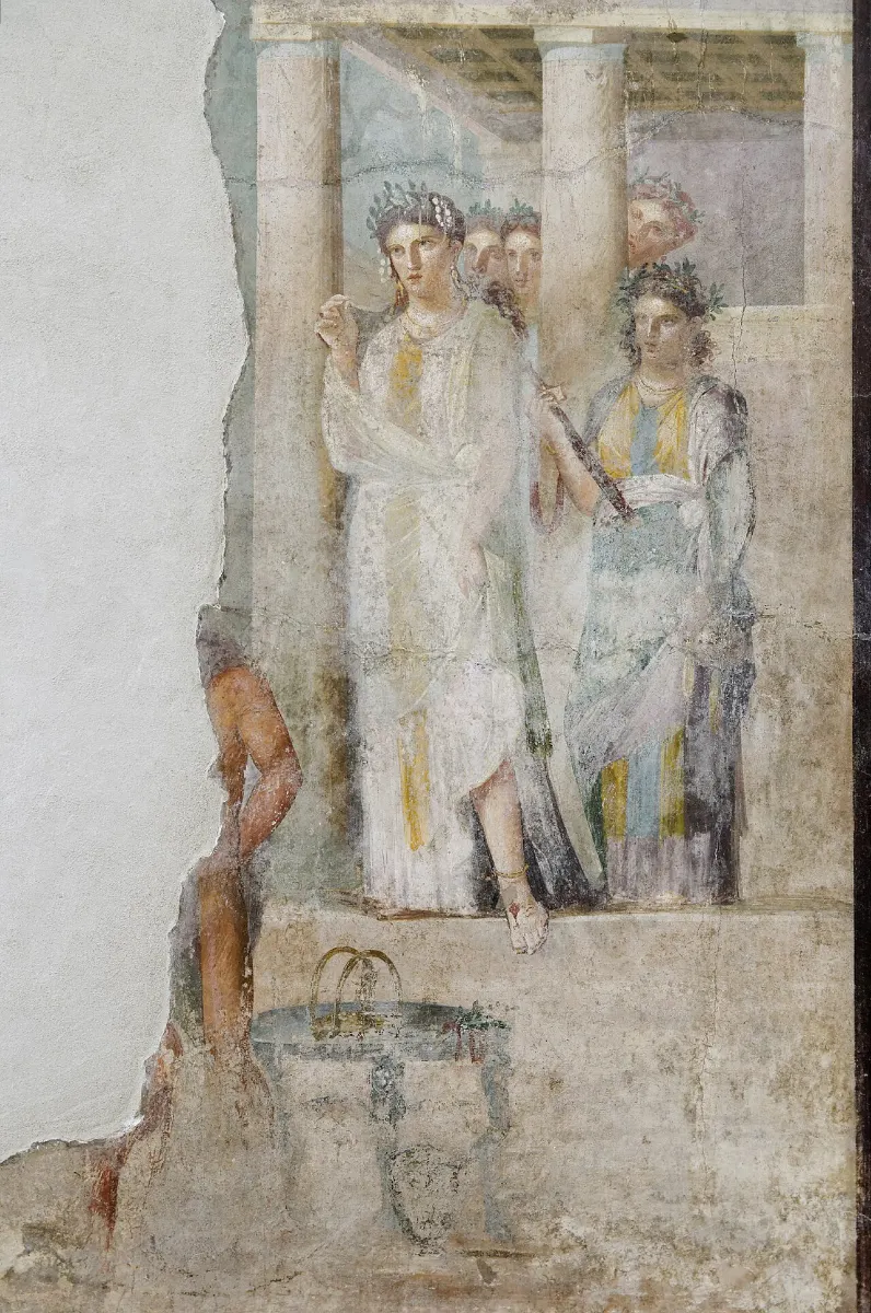 Fresco: a priestess in white with attendants steps out of a temple porch towards the viewer.