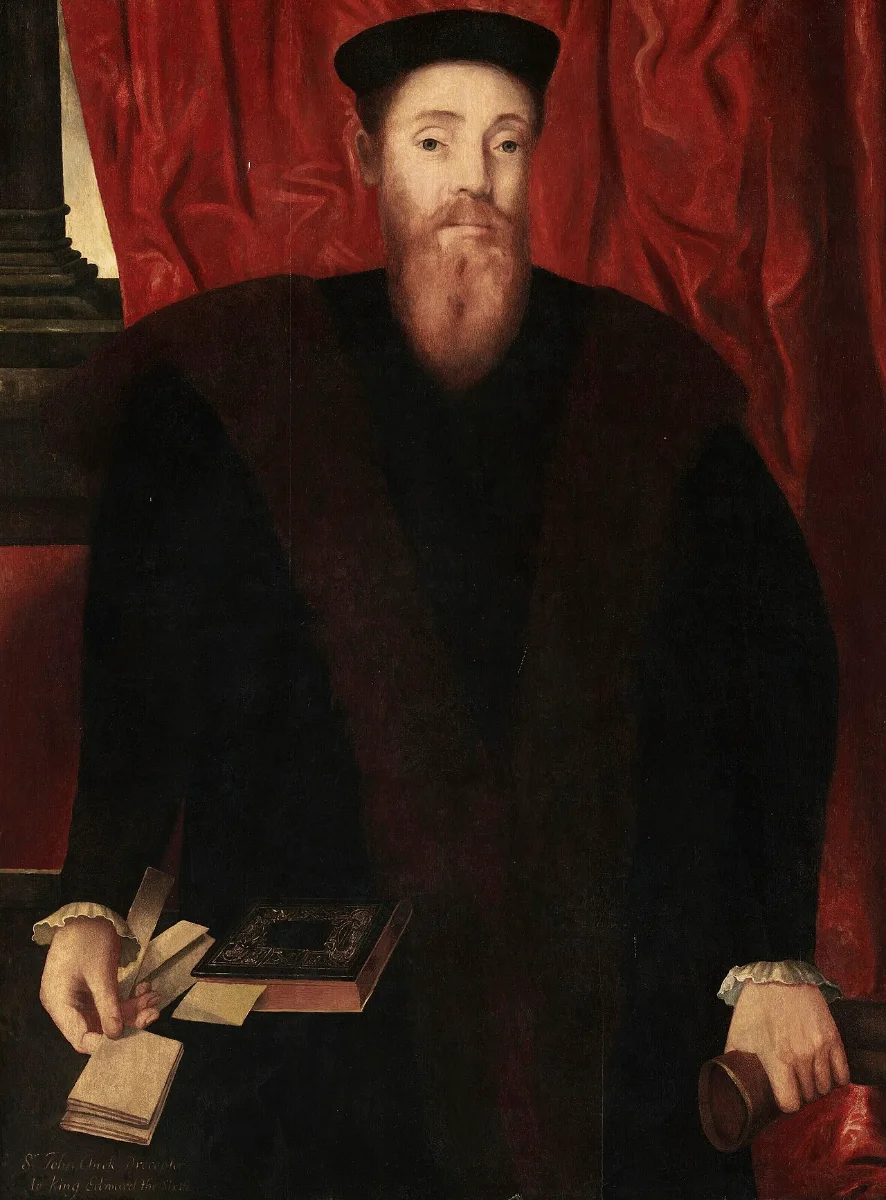 Painted portrait of a red-bearded man in a black cap and fur-trimmed gown, seated with a book.