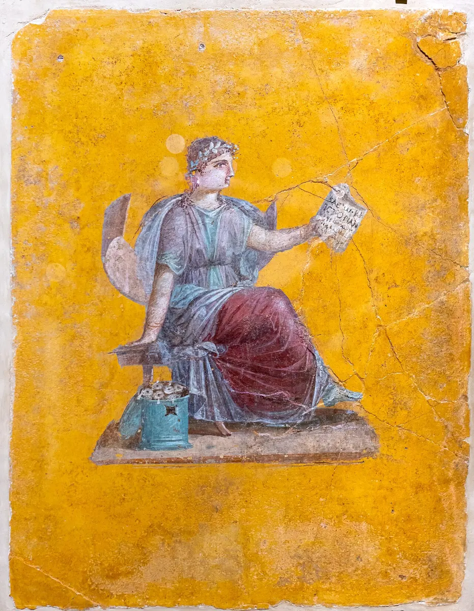 Wall painting on a yellow ground: a seated woman reads an unrolled papyrus roll; a cylindrical box of rolls stands beside her.