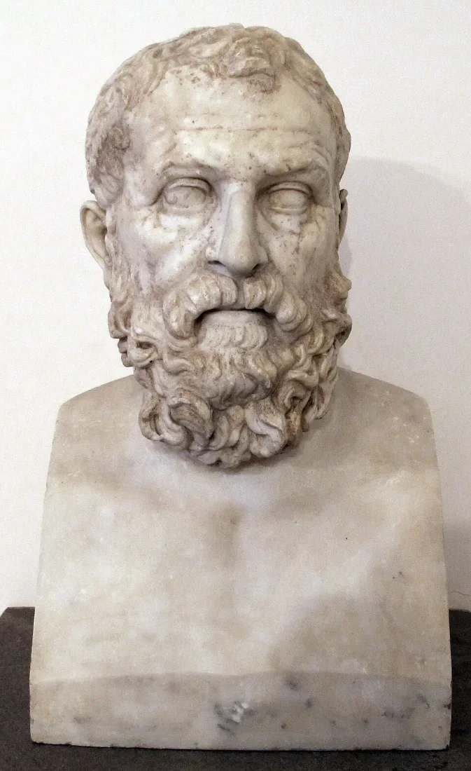A marble bust of a bearded man.