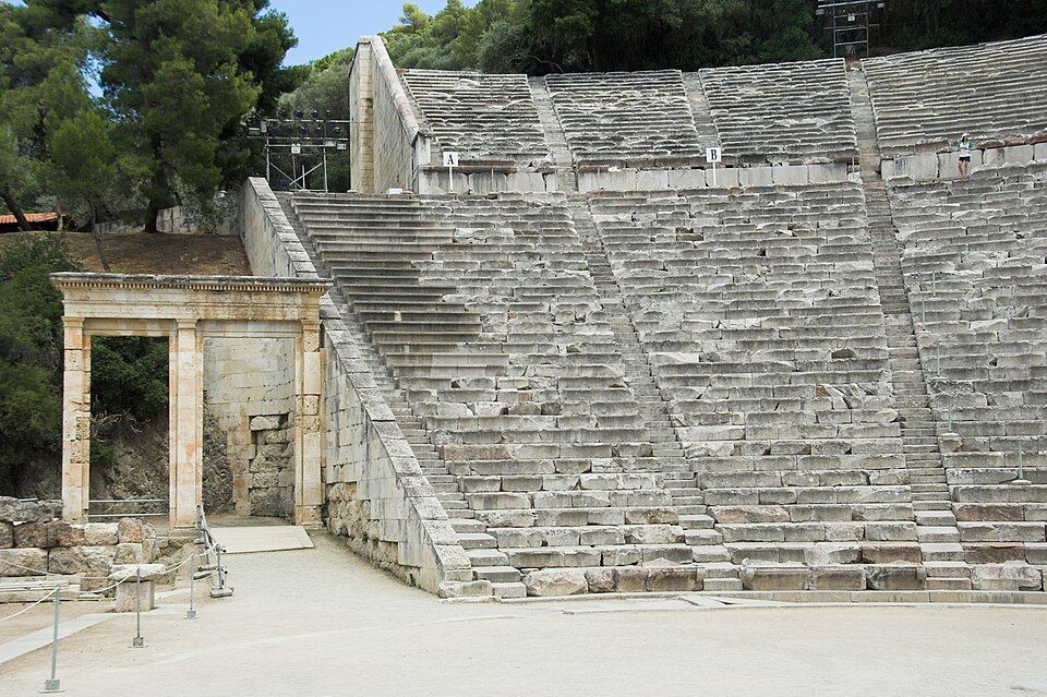 Stone tiers of seats rising around a circular orchestra.