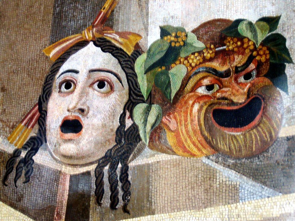 Mosaic of two theatre masks, one tragic and one comic.