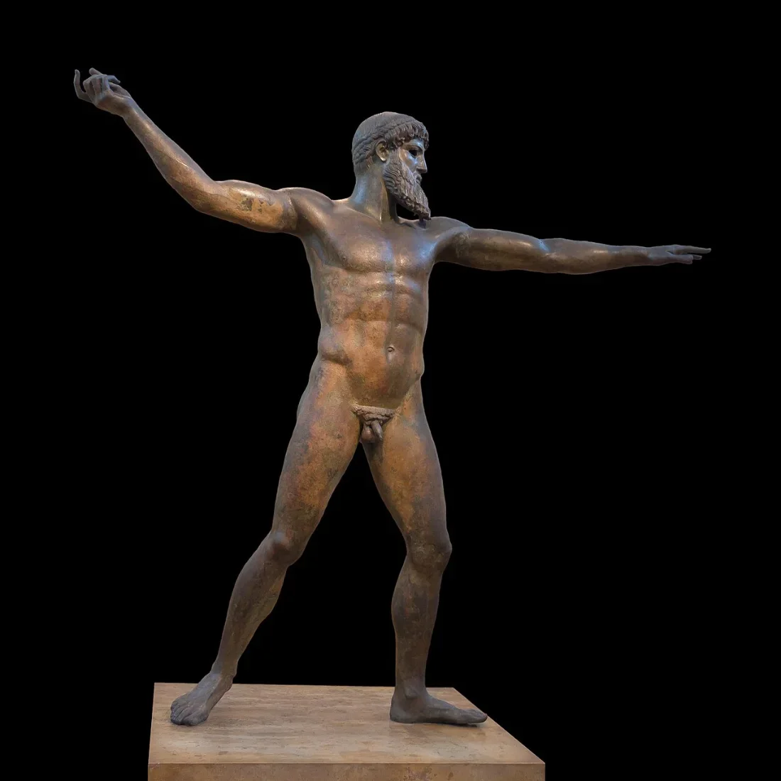 A bronze statue of a bearded god, striding, with one arm stretched forward ready to throw.